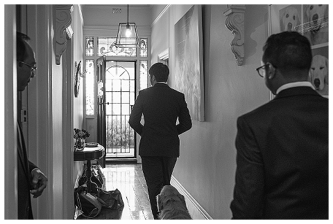 groom walking down hallway