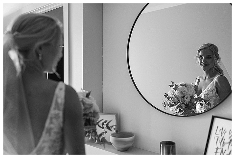 Bride looking in mirror